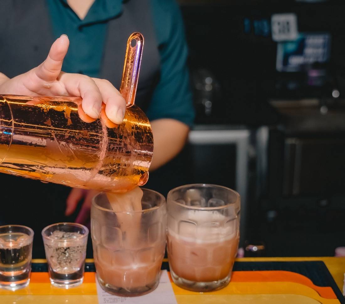 Bartender pouring at the bar top, Father’s Office Downtown